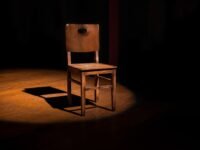 vacant brown wooden armless chair