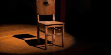 vacant brown wooden armless chair